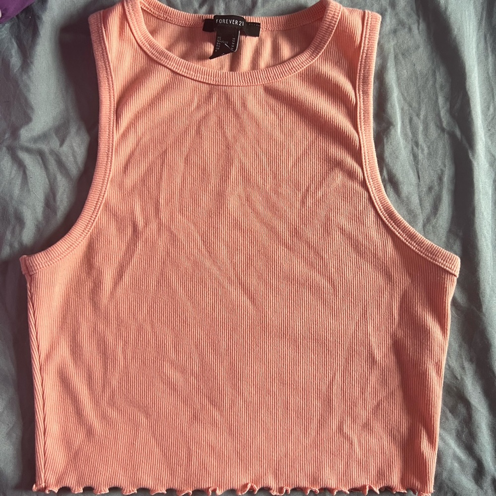 This is a cropped coral tank top